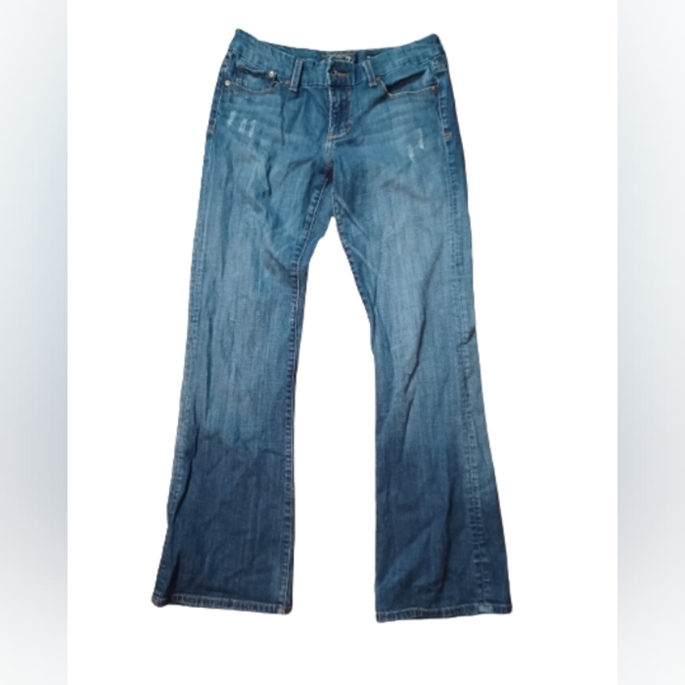 Seven boot cut distressed jeans.